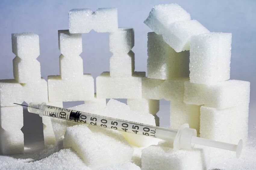 Sugar and on it is a syringe, signifying that sugar is an evil drug.